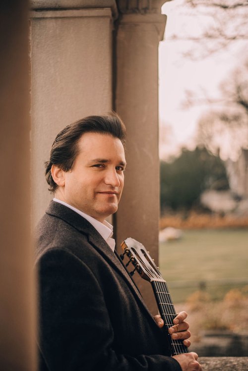 René Izquierdo holding a classical guitar