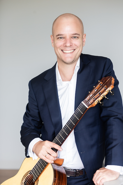 Simon Powis with a classical guitar
